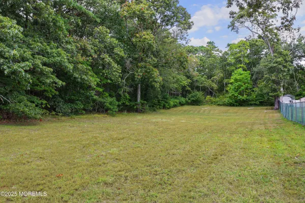 a view of a field with an outdoor space