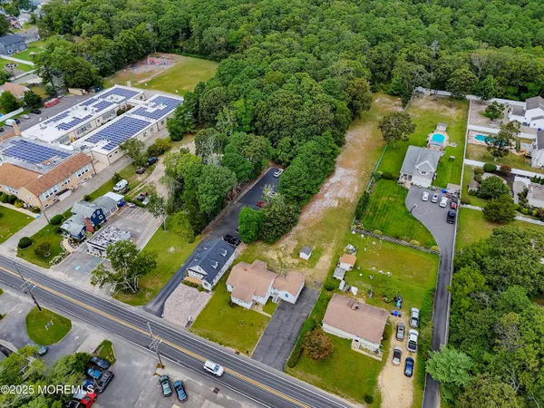 an aerial view of residential houses with outdoor space