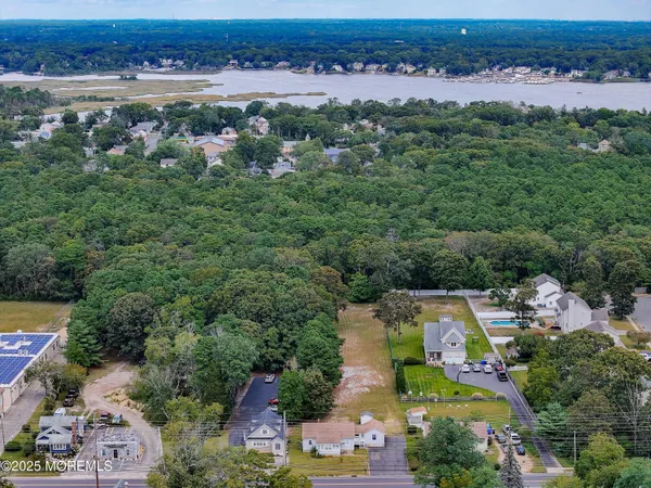 an aerial view of a city with lots of residential buildings and mountain view