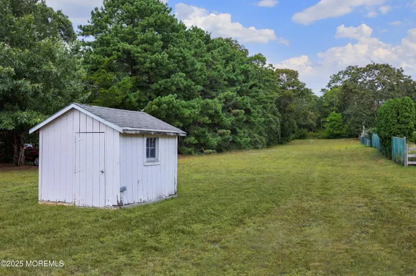 a view of a backyard with a cabin