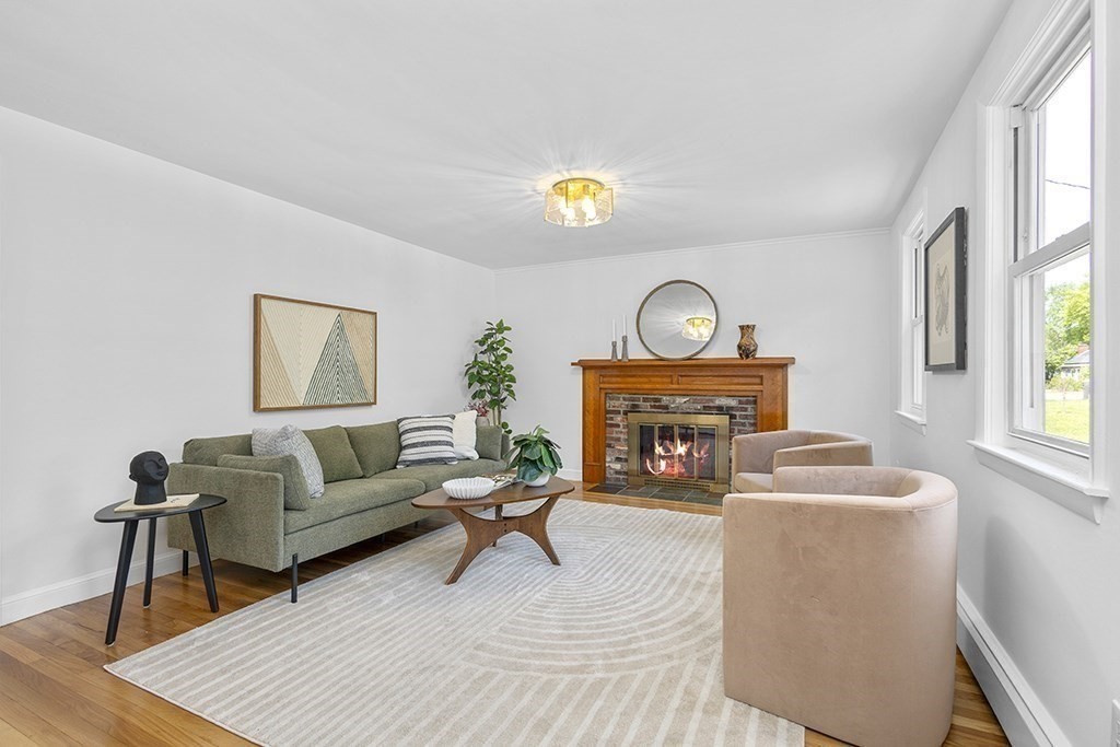 117 Oak Ridge Drive Ayer, MA 01432 - Photo 3 of 26 a living room with furniture a fireplace and a window