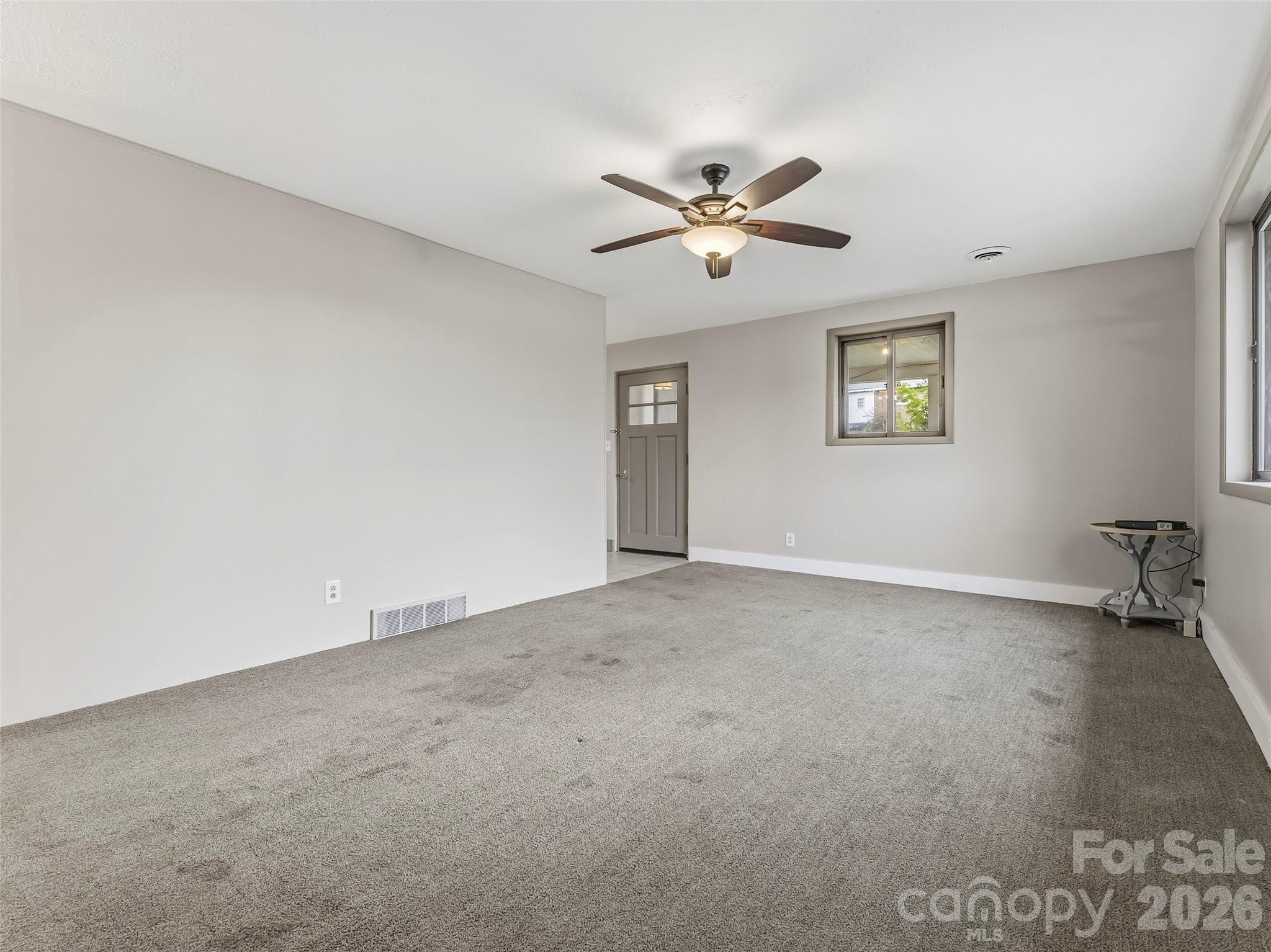 605 Dana Road Hendersonville, NC 28792 - Photo 11 of 38 a view of empty room with window