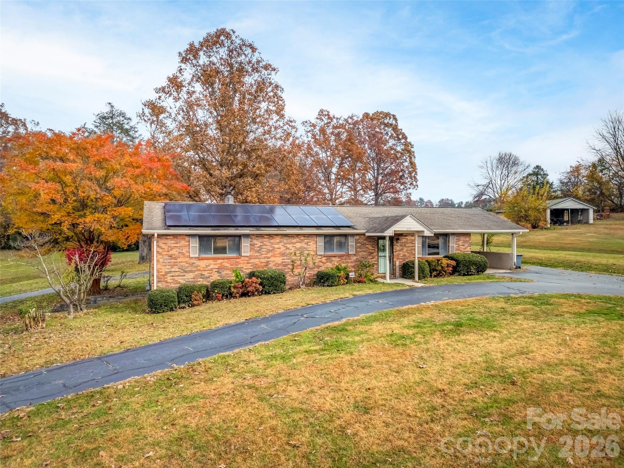 605 Dana Road Hendersonville, NC 28792 - Photo 2 of 38 a front view of a house with a yard
