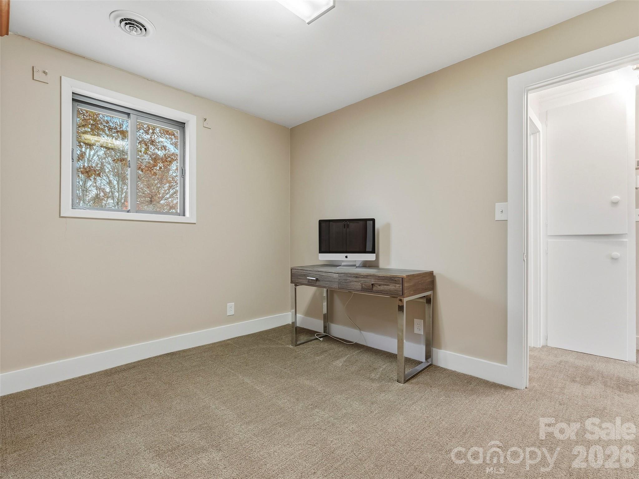605 Dana Road Hendersonville, NC 28792 - Photo 24 of 38 a view of a workspace with furniture and a window