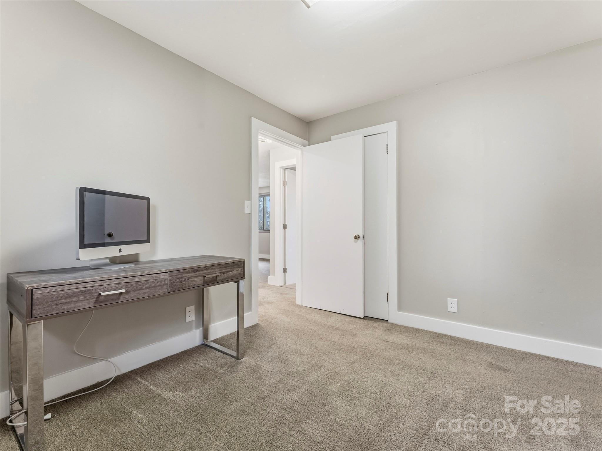 605 Dana Road Hendersonville, NC 28792 - Photo 24 of 38 a view of a room with a sink and a mirror