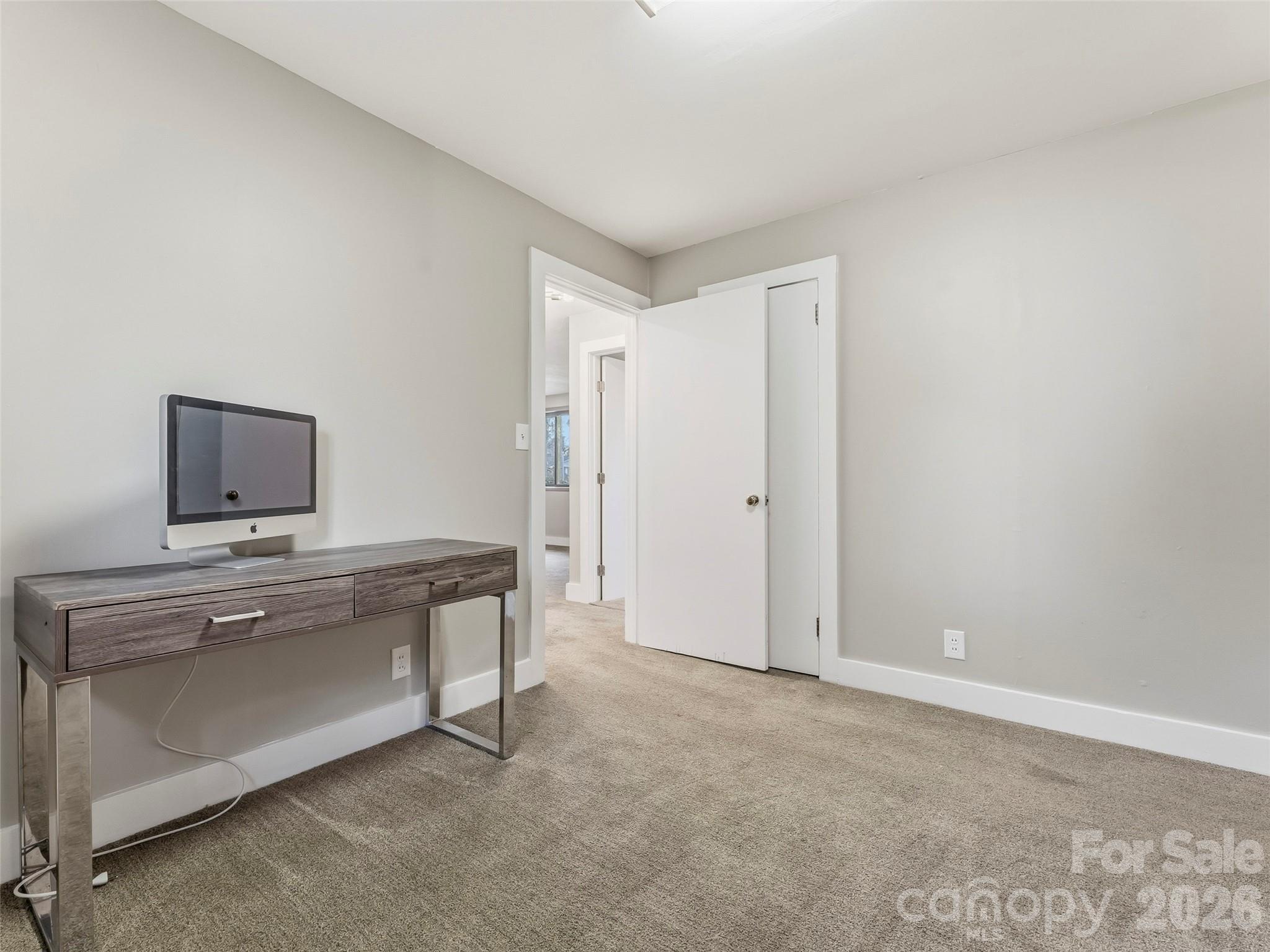 605 Dana Road Hendersonville, NC 28792 - Photo 25 of 38 a view of a room with a sink and a mirror