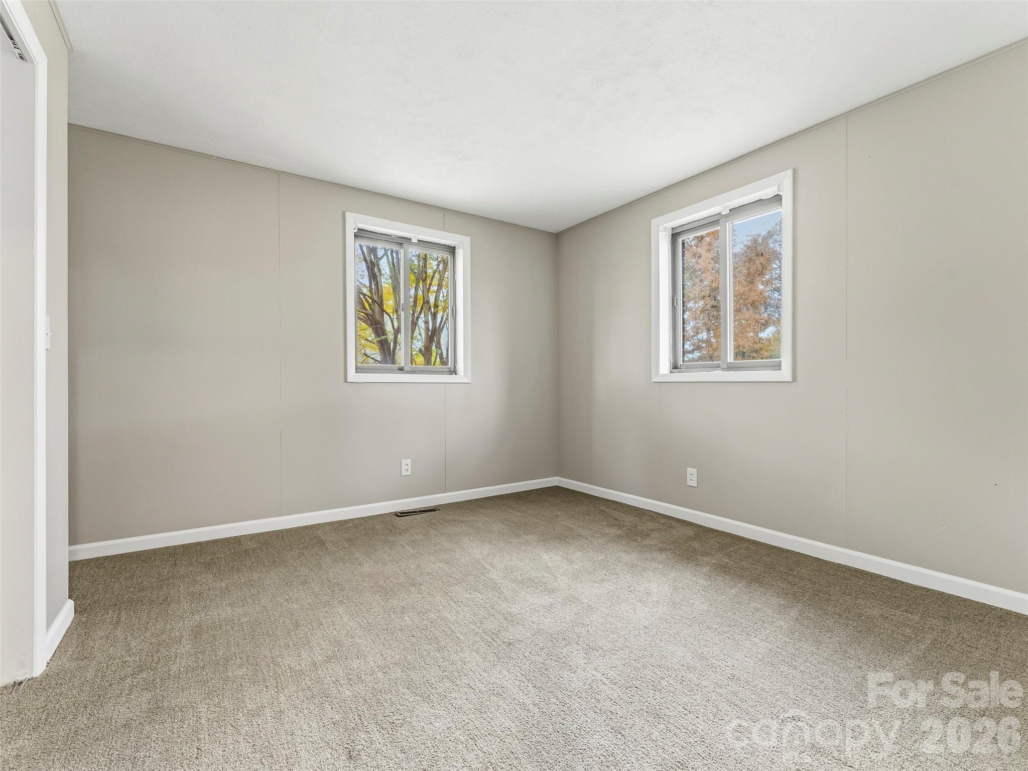 605 Dana Road Hendersonville, NC 28792 - Photo 28 of 38 an empty room with windows