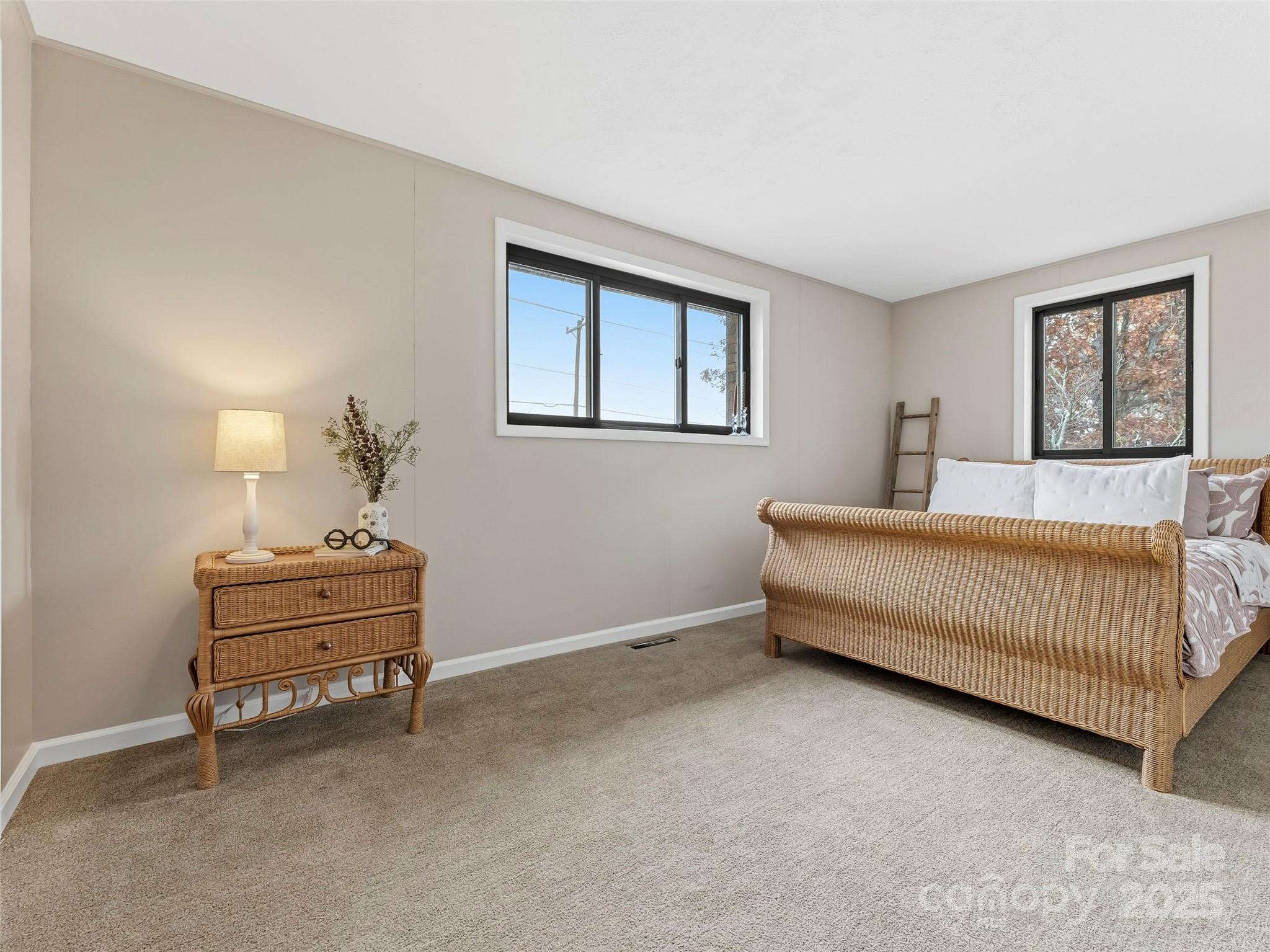 605 Dana Road Hendersonville, NC 28792 - Photo 28 of 38 a bedroom with a bed and a window