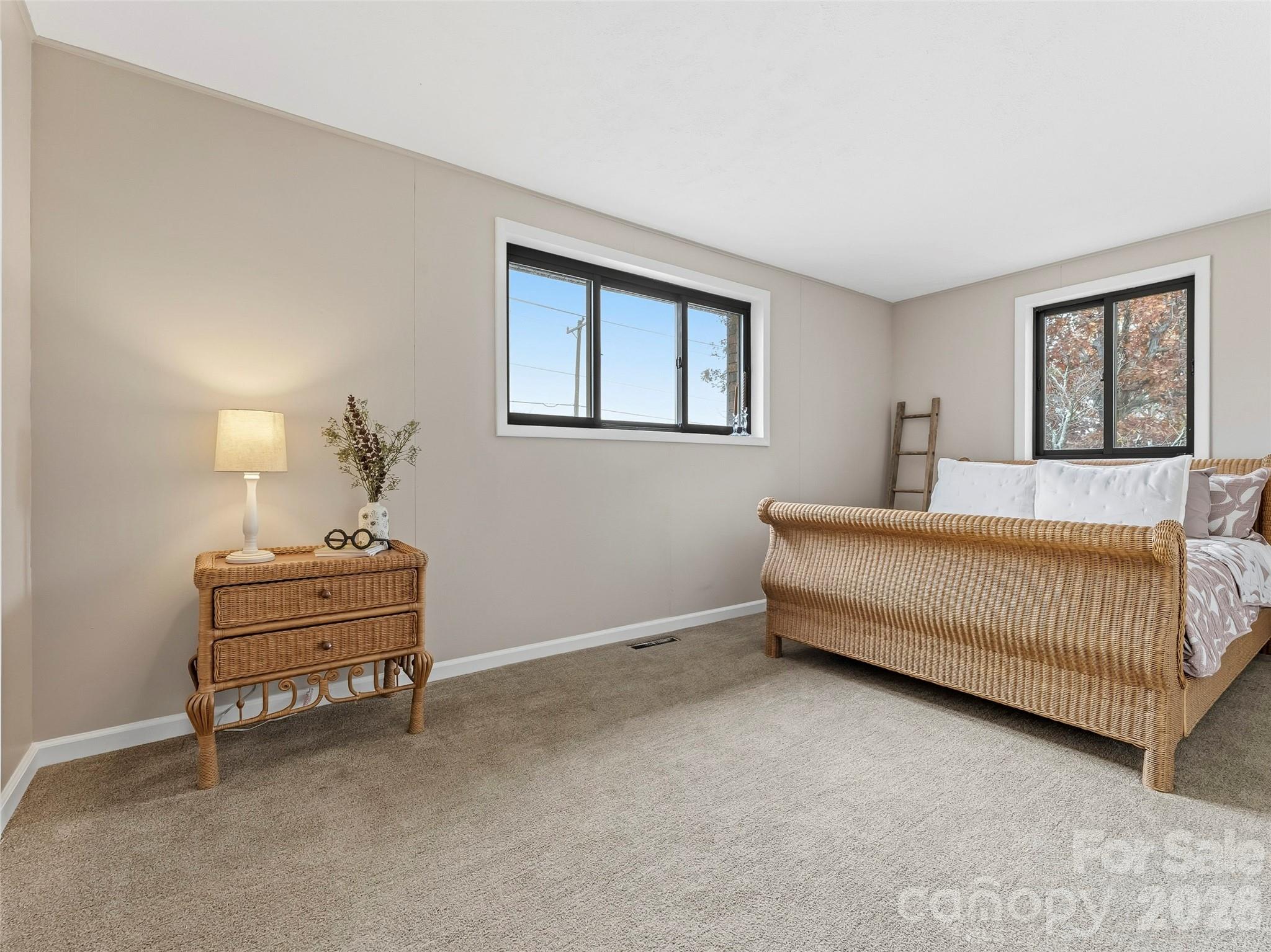 605 Dana Road Hendersonville, NC 28792 - Photo 29 of 38 a bedroom with a bed and a window