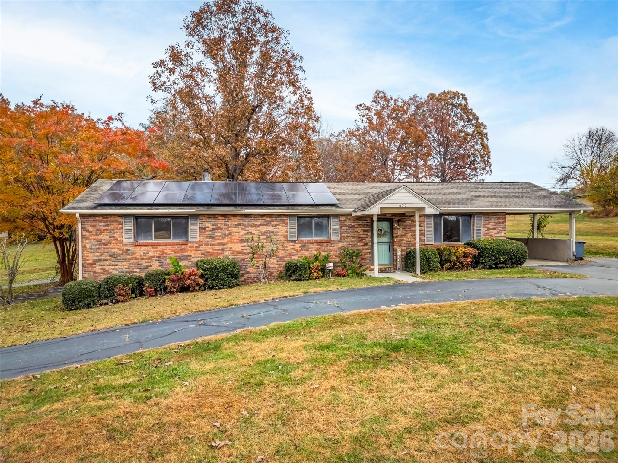 605 Dana Road Hendersonville, NC 28792 - Photo 3 of 38 a front view of a house with a yard