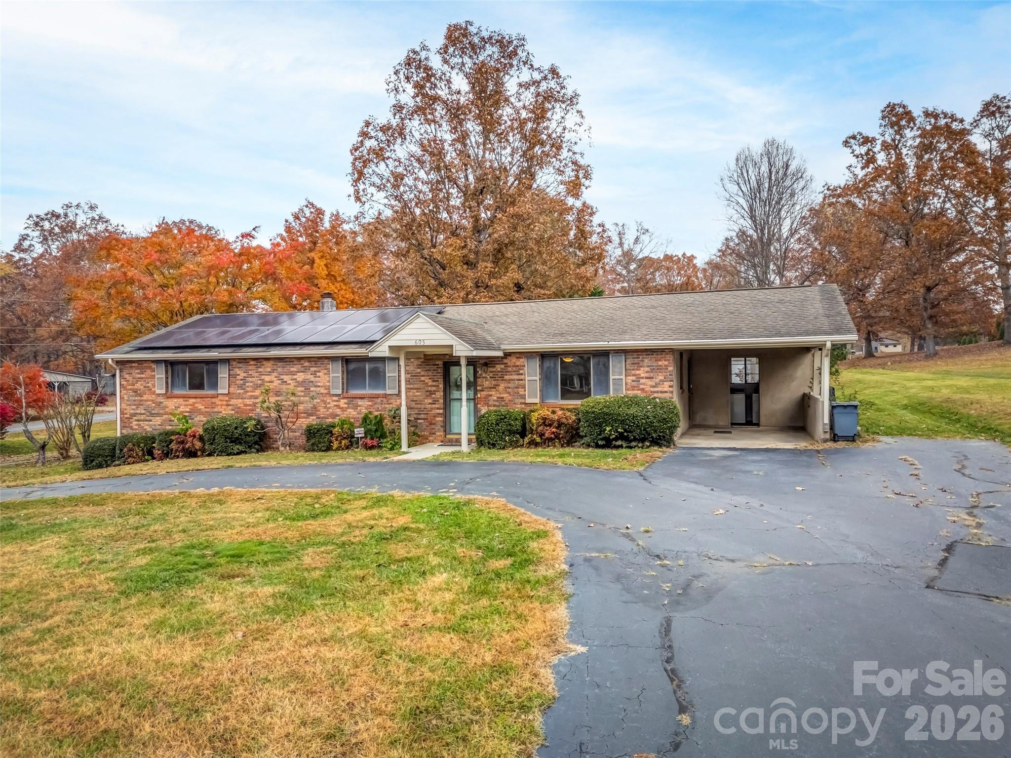 605 Dana Road Hendersonville, NC 28792 - Photo 35 of 38 a front view of a house with a yard and porch