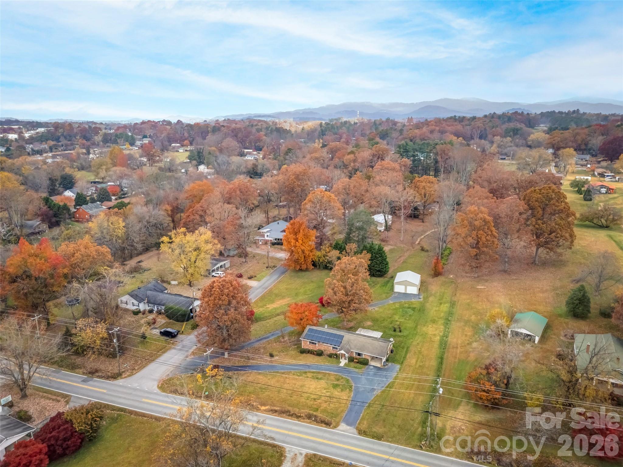 605 Dana Road Hendersonville, NC 28792 - Photo 38 of 38 an aerial view of residential houses with outdoor space