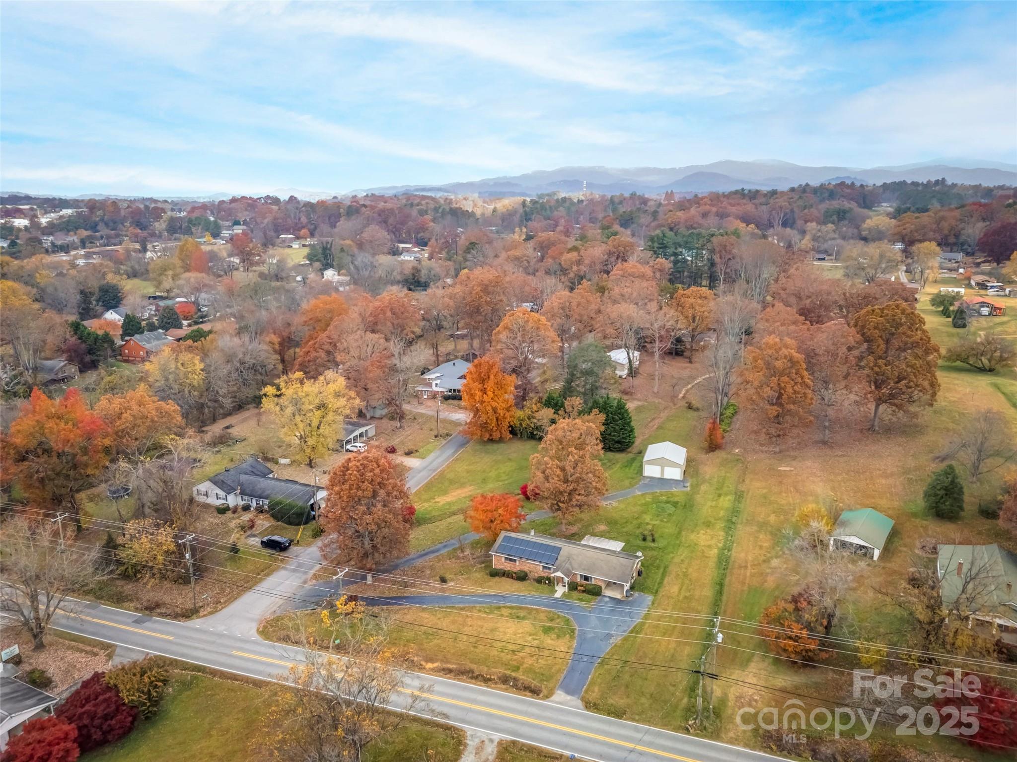 605 Dana Road Hendersonville, NC 28792 - Photo 38 of 38 an aerial view of residential houses with outdoor space