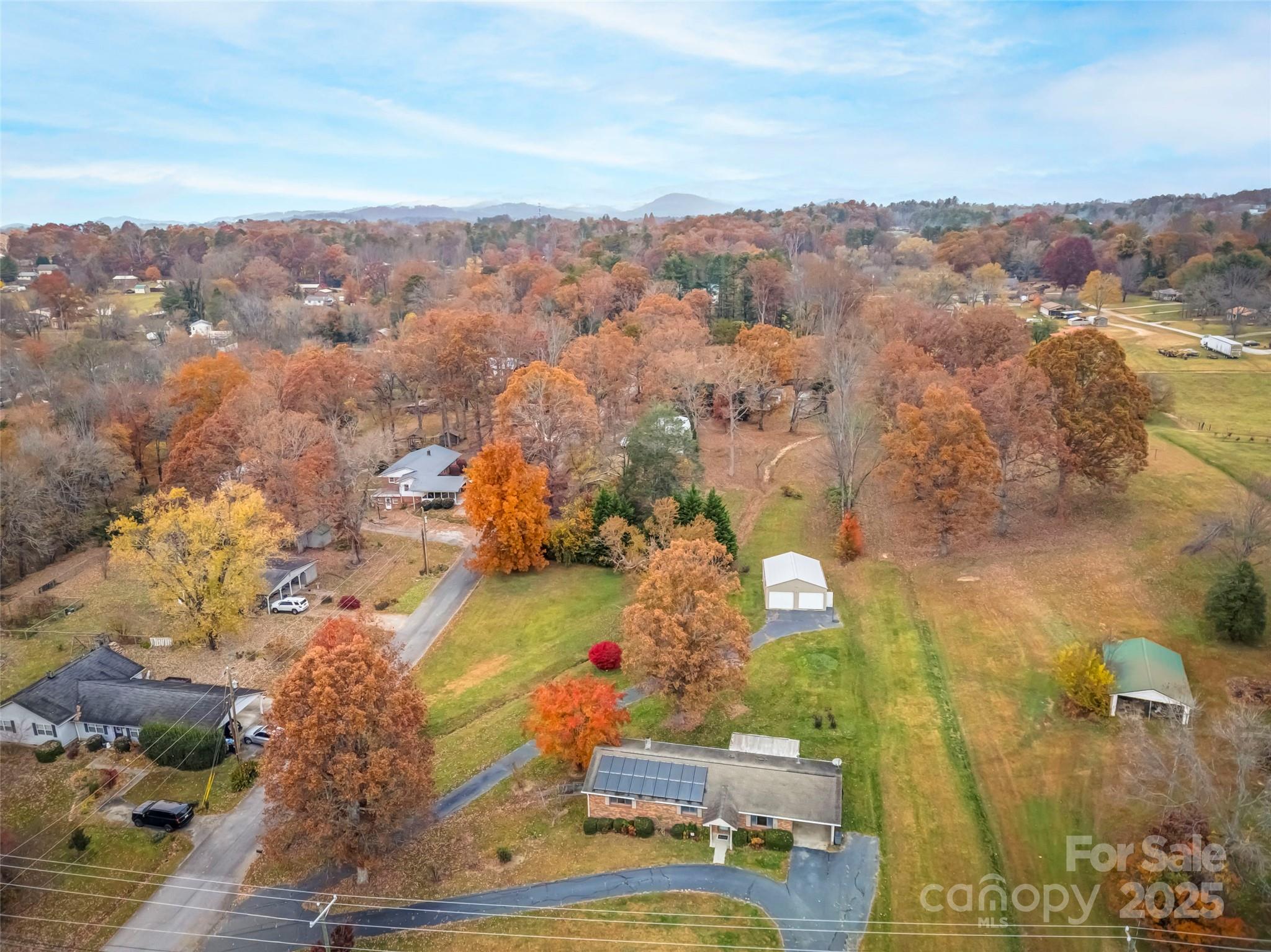 605 Dana Road Hendersonville, NC 28792 - Photo 4 of 38 an aerial view of residential houses with outdoor space
