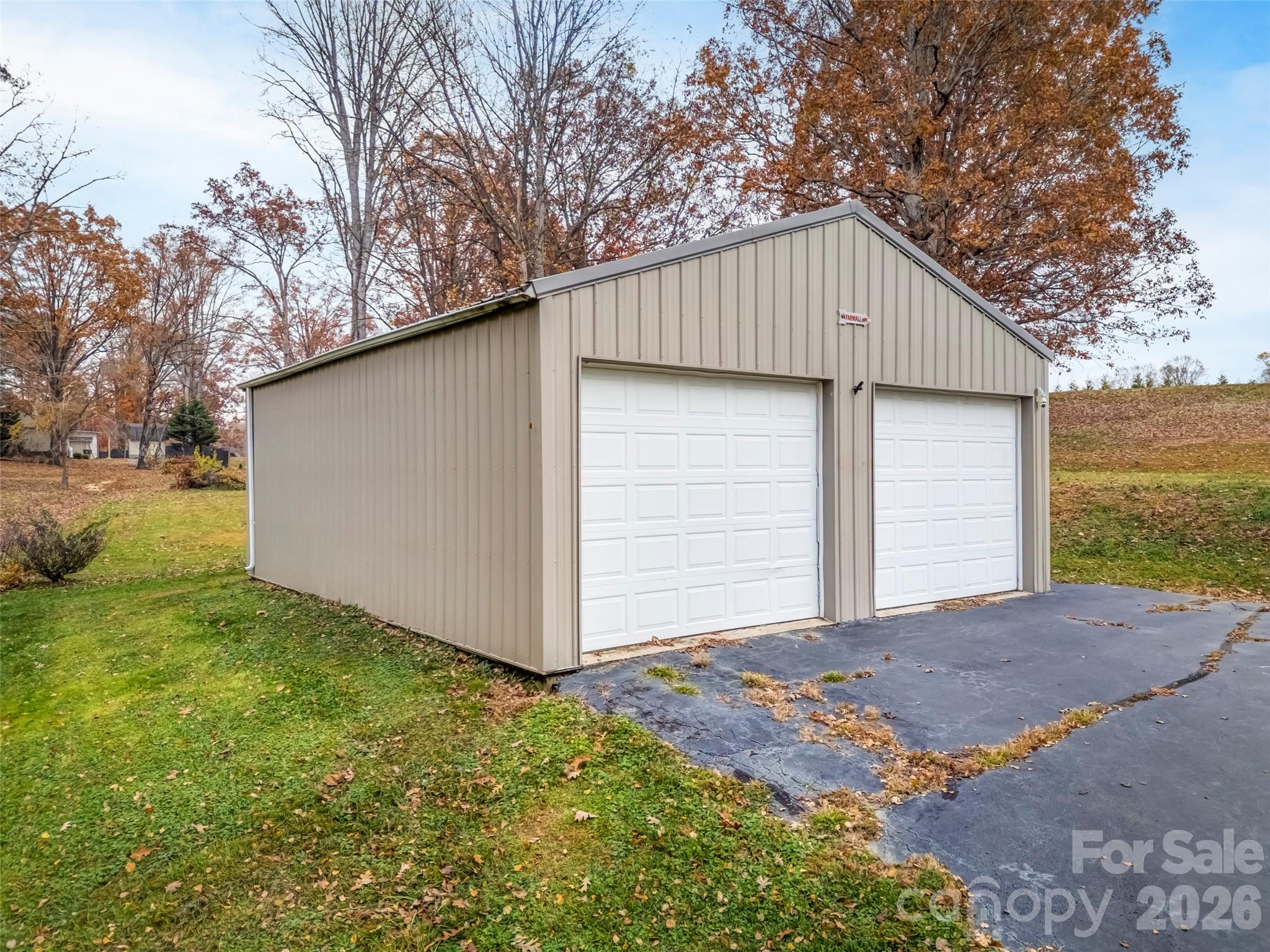605 Dana Road Hendersonville, NC 28792 - Photo 6 of 38 a view of a house with a yard