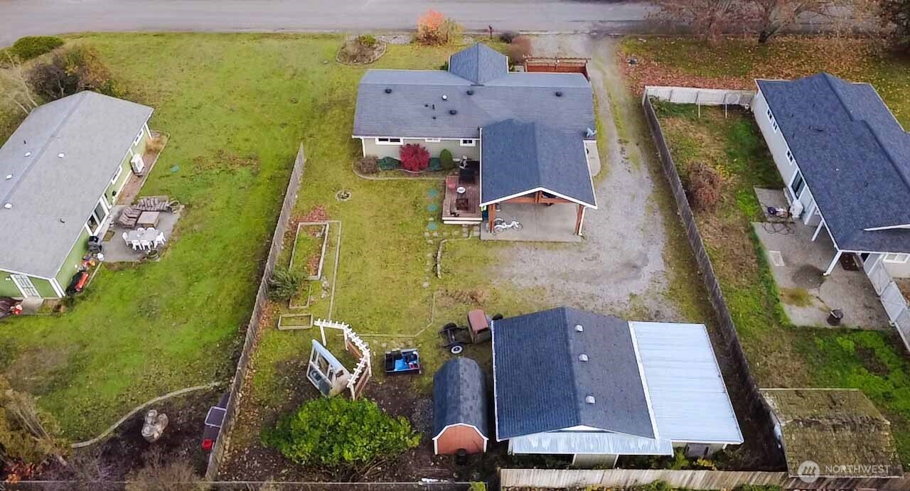 151 Valley View Drive Sequim, WA 98382 - Photo 39 of 40 an aerial view of residential houses with outdoor space and swimming pool