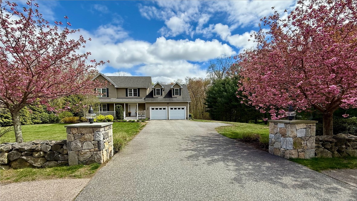 288 Middle Road East Greenwich, RI 02818 - Photo 1 of 30 Beautiful stone entrance and flowering Cherry trees frame the entrance to the property.