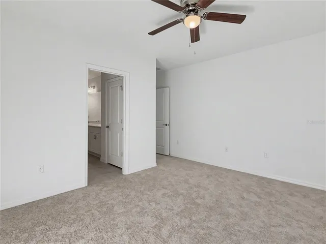 a bathroom with a double vanity sink and mirror