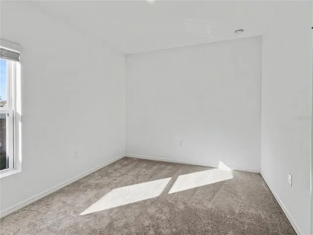 an empty room with closet area