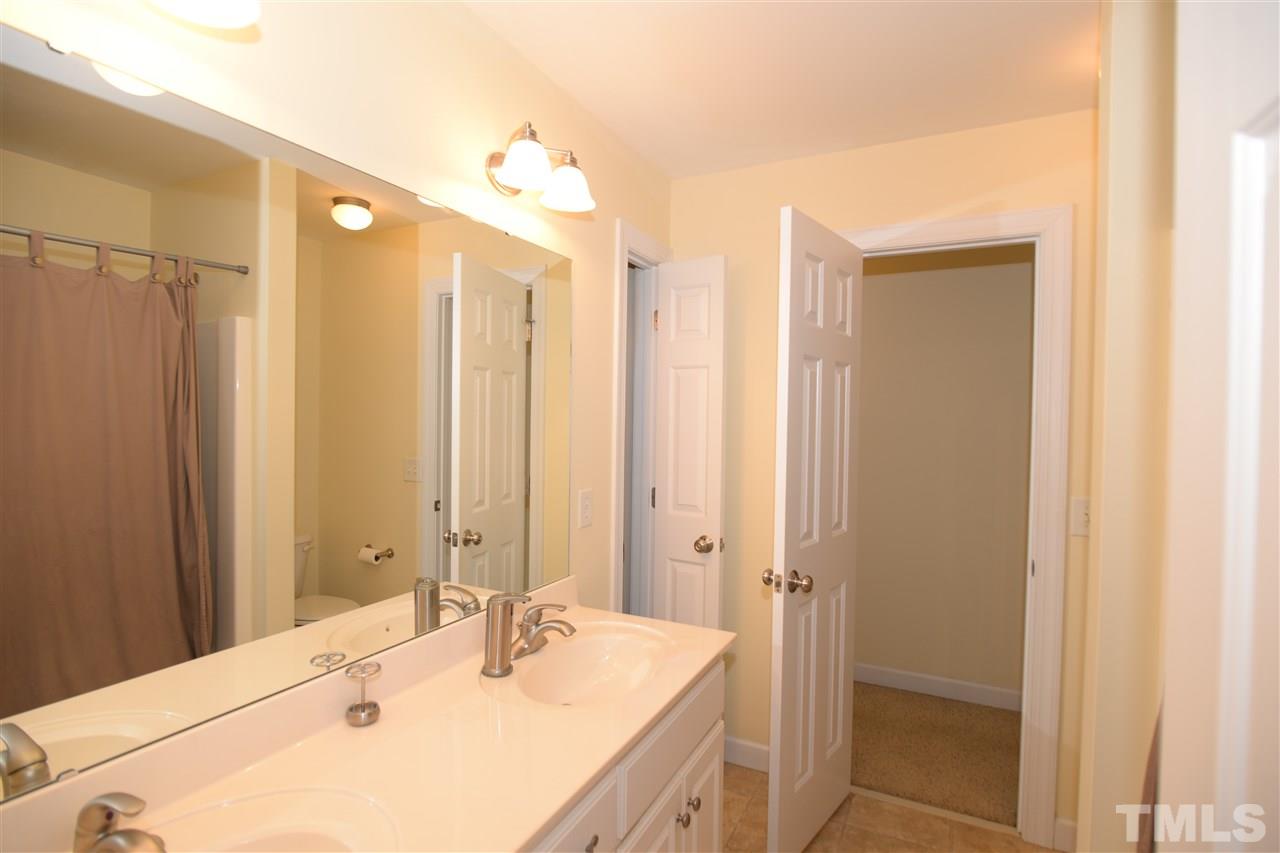1021 Grissom Farm Road Garner, NC 27529 - Photo 15 of 25 a bathroom with a sink and a mirror