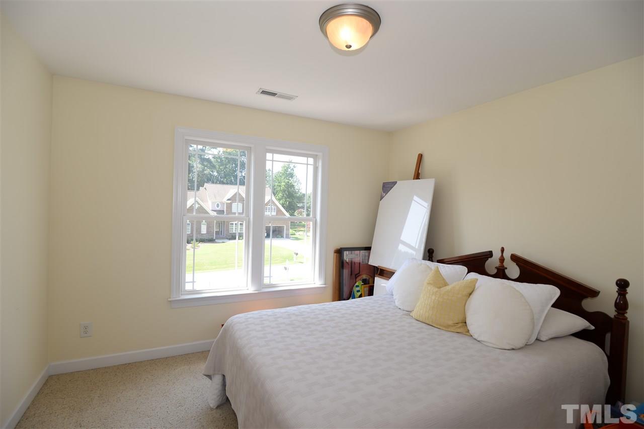 1021 Grissom Farm Road Garner, NC 27529 - Photo 16 of 25 a bedroom with a bed and window
