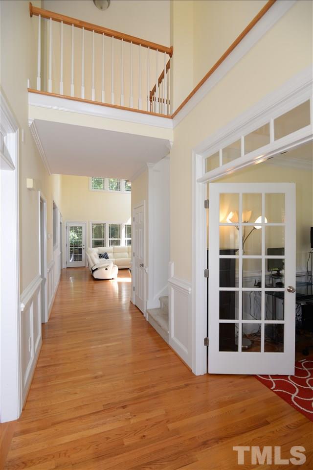 1021 Grissom Farm Road Garner, NC 27529 - Photo 3 of 25 a view of a big room with wooden floor and furniture