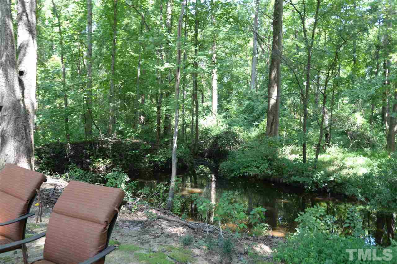 1021 Grissom Farm Road Garner, NC 27529 - Photo 23 of 25 a view of backyard with green space and seating area