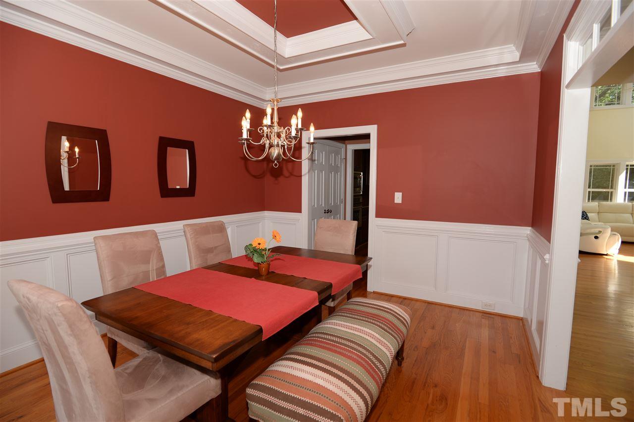 1021 Grissom Farm Road Garner, NC 27529 - Photo 5 of 25 a bed room with a bed and a table
