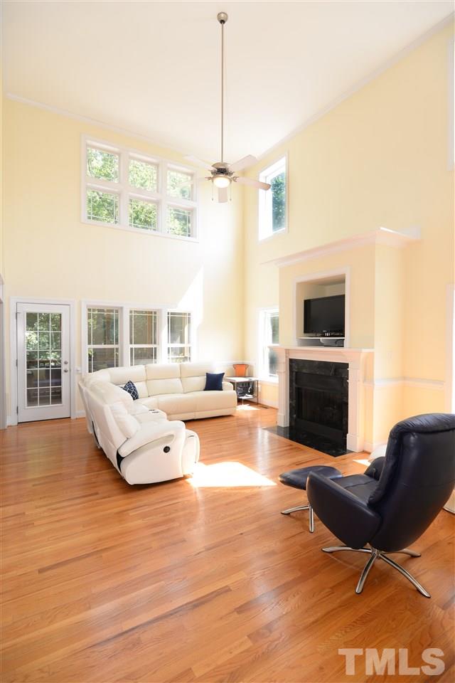 1021 Grissom Farm Road Garner, NC 27529 - Photo 6 of 25 a living room with furniture or fireplace and a wooden floor