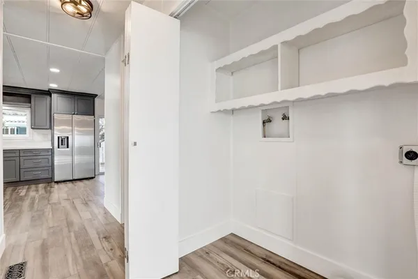 a view of a hallway with a living room