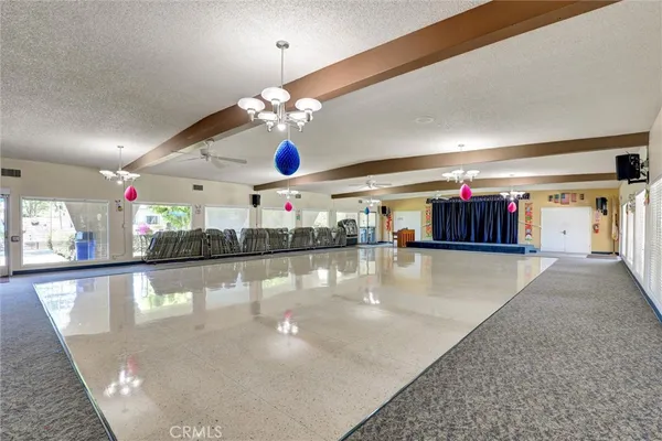 a room with gym equipment and a flat screen tv