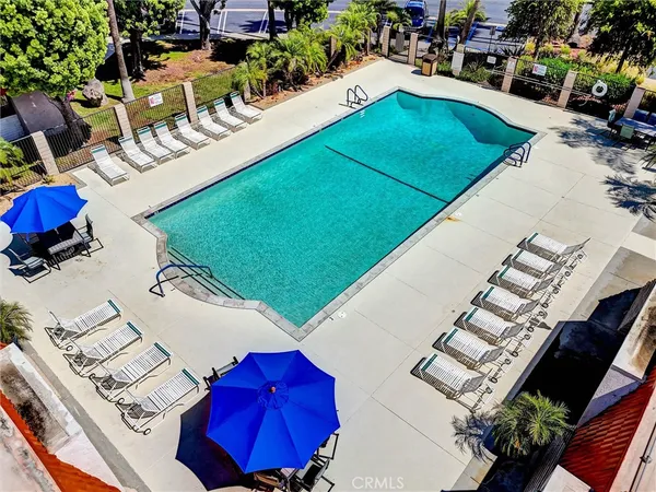 a view of a swimming pool with outdoor seating