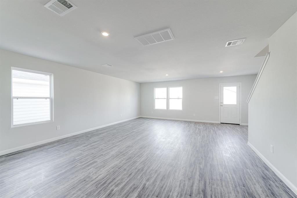 13417 Balderdash Court Cresson, TX 76035 - Photo 18 of 40 an empty room with wooden floor and windows