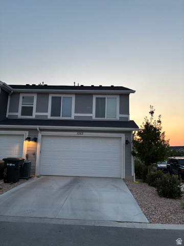 673 West 1920 South, Unit 1063 Provo, UT 84601 - Photo 15 of 15 Two-story residence featuring a two-car garage with a concrete driveway