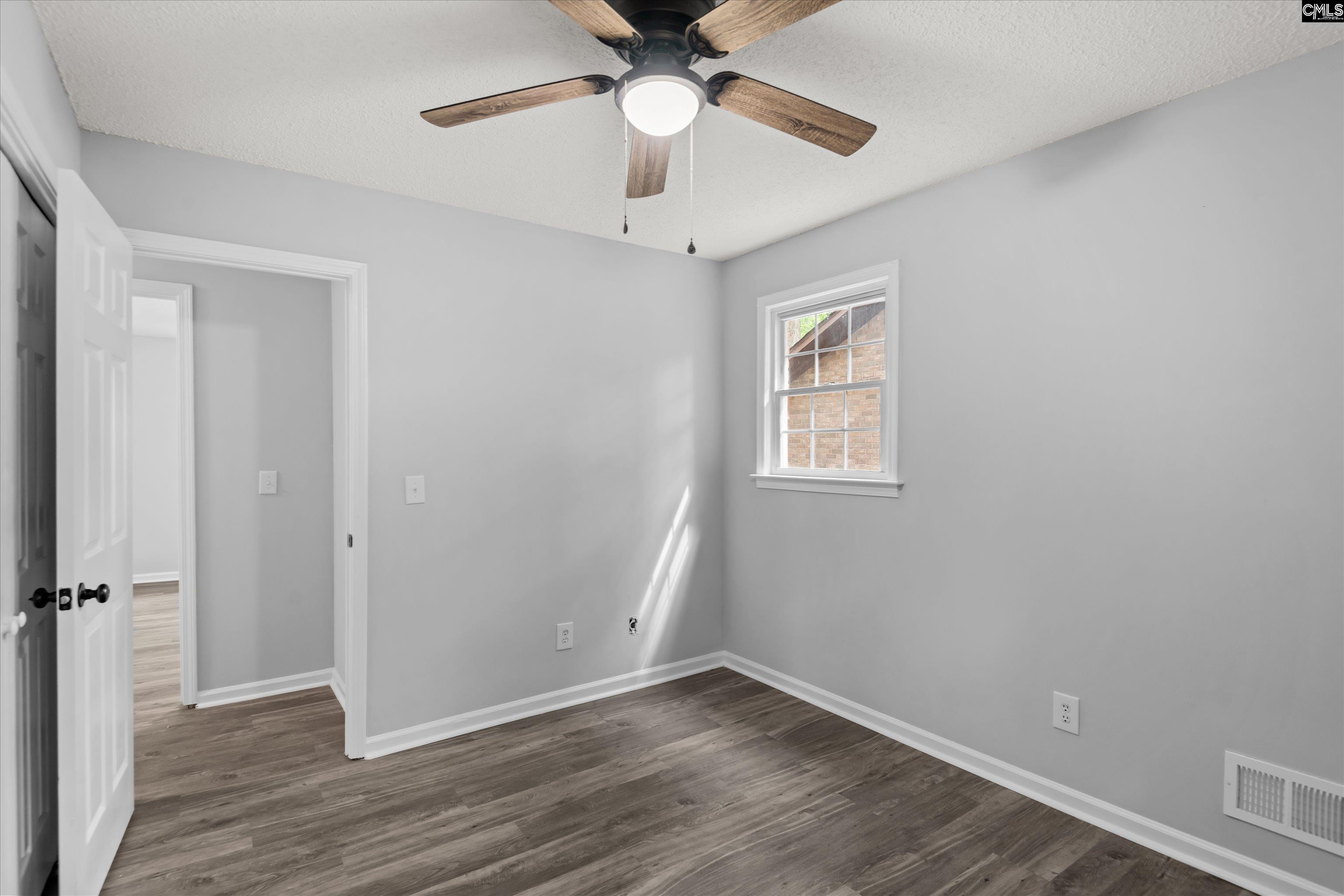245 Piney Grove Road Columbia, SC 29210 - Photo 22 of 29 wooden floor in an empty room with a window
