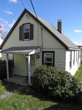 88 Hardy Pond Road Waltham, MA 02451 - Photo 1 of 29 a front view of a house with a yard
