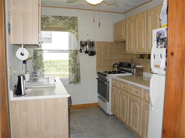 88 Hardy Pond Road Waltham, MA 02451 - Photo 12 of 29 a kitchen with stainless steel appliances a sink a stove a refrigerator a window