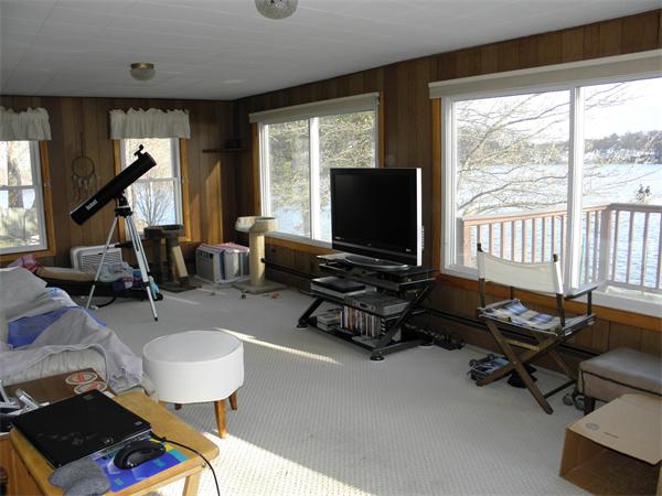 88 Hardy Pond Road Waltham, MA 02451 - Photo 13 of 29 a living room with furniture and a flat screen tv
