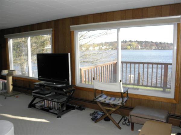 88 Hardy Pond Road Waltham, MA 02451 - Photo 14 of 29 a living room with furniture and a flat screen tv