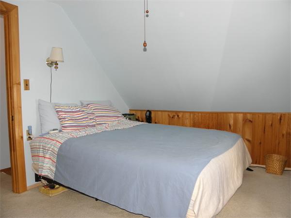 88 Hardy Pond Road Waltham, MA 02451 - Photo 17 of 29 a bedroom with a bed and a night stand