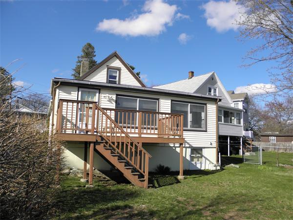 88 Hardy Pond Road Waltham, MA 02451 - Photo 5 of 29 a view of a house with a yard and deck