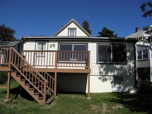 88 Hardy Pond Road Waltham, MA 02451 - Photo 6 of 29 a front view of a house with yard and garage