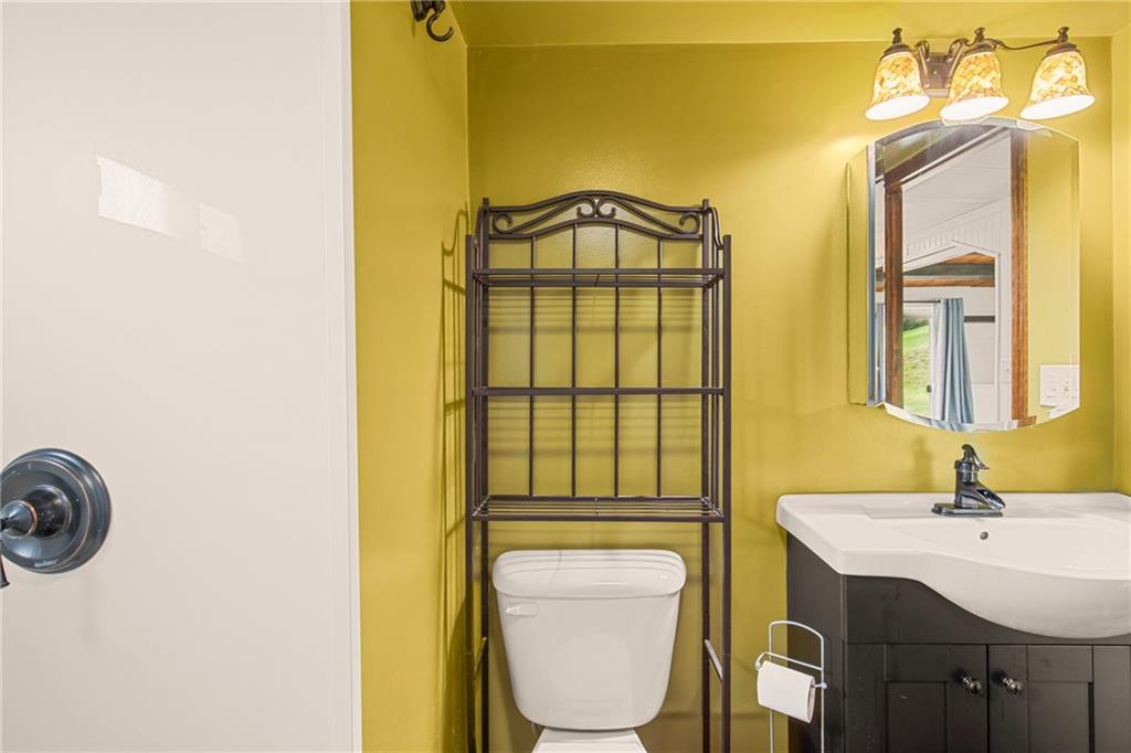 189 Anna Beth Road Acme, PA 15610 - Photo 16 of 32 a bathroom with a sink and a mirror