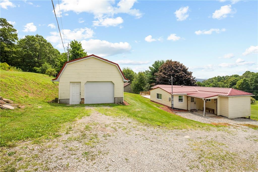 189 Anna Beth Road Acme, PA 15610 - Photo 21 of 32 a view of a house with a yard and sitting area