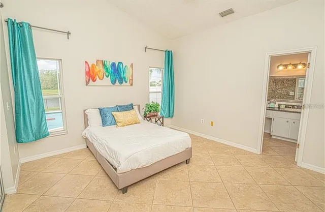 a bedroom with a bed and a cabinets