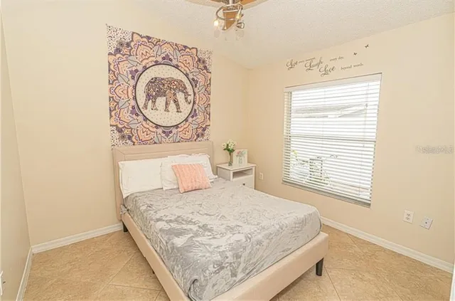 a bedroom with a bed and a window in it