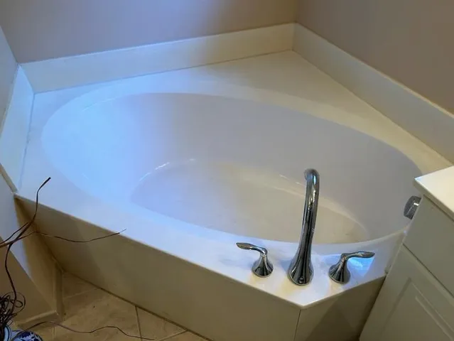 a white toilet sitting next to a white sink