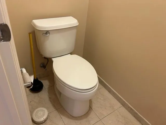a bathroom with a toilet and a sink