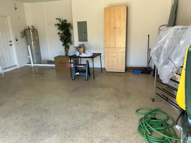 a living room with furniture and flowers