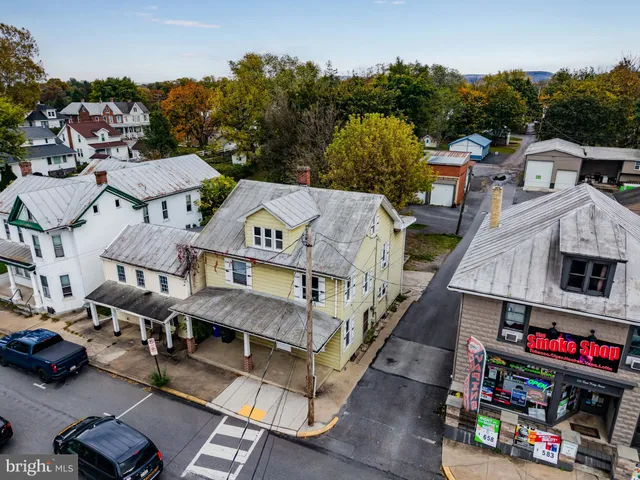 a view of multiple houses with a city street